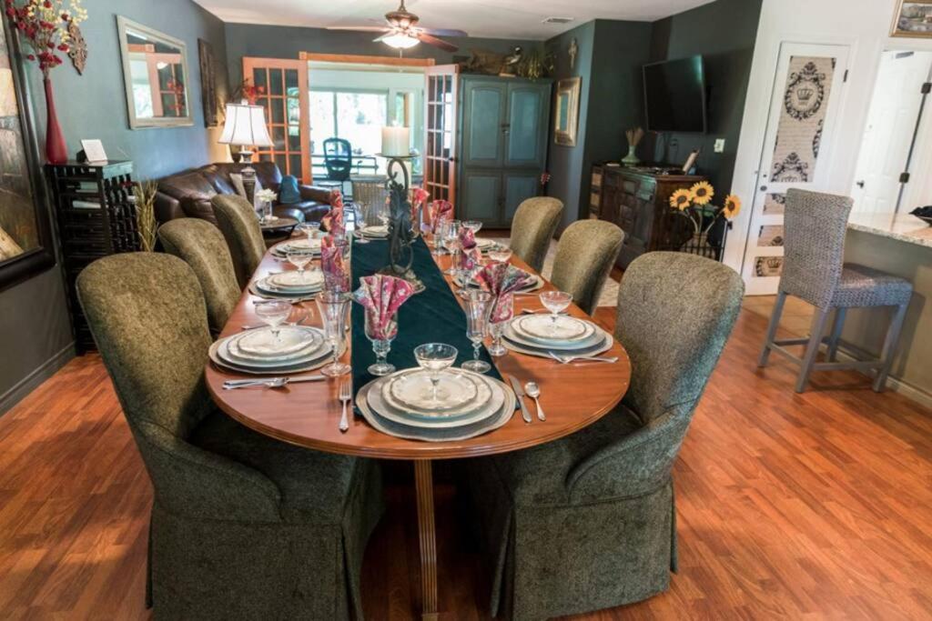 a dining room table with chairs and a dining room at La Villetta in Dripping Springs