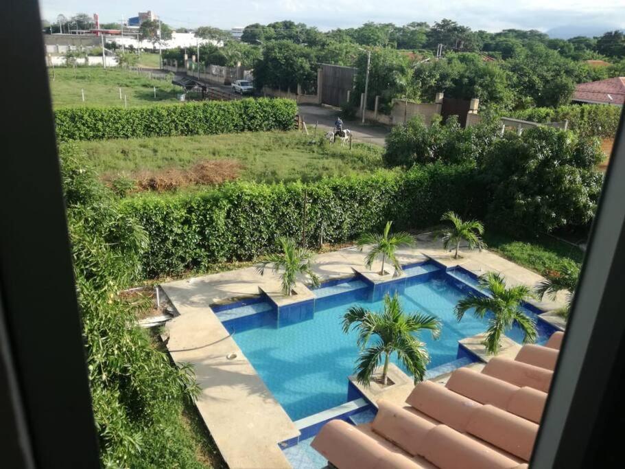 a view of a swimming pool from a resort at Cabaña Milan in Aguachica