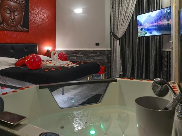 Televízia a/alebo spoločenská miestnosť v ubytovaní Sicily Suite
