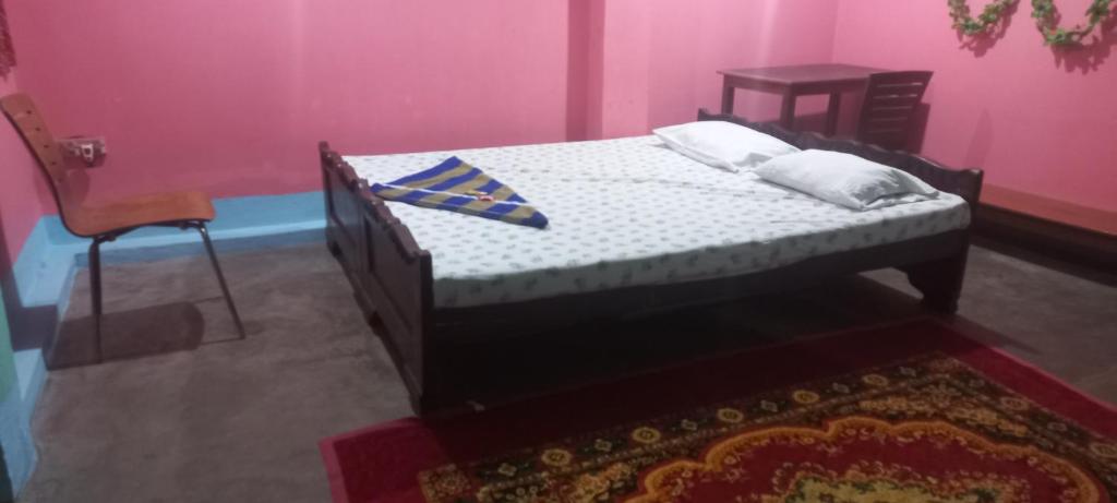 Postel nebo postele na pokoji v ubytování Kiran Guest House