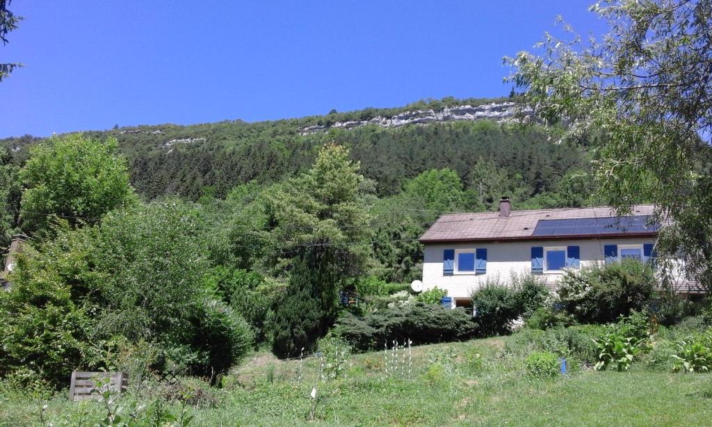 a house in the middle of a mountain at HAUT JURA 