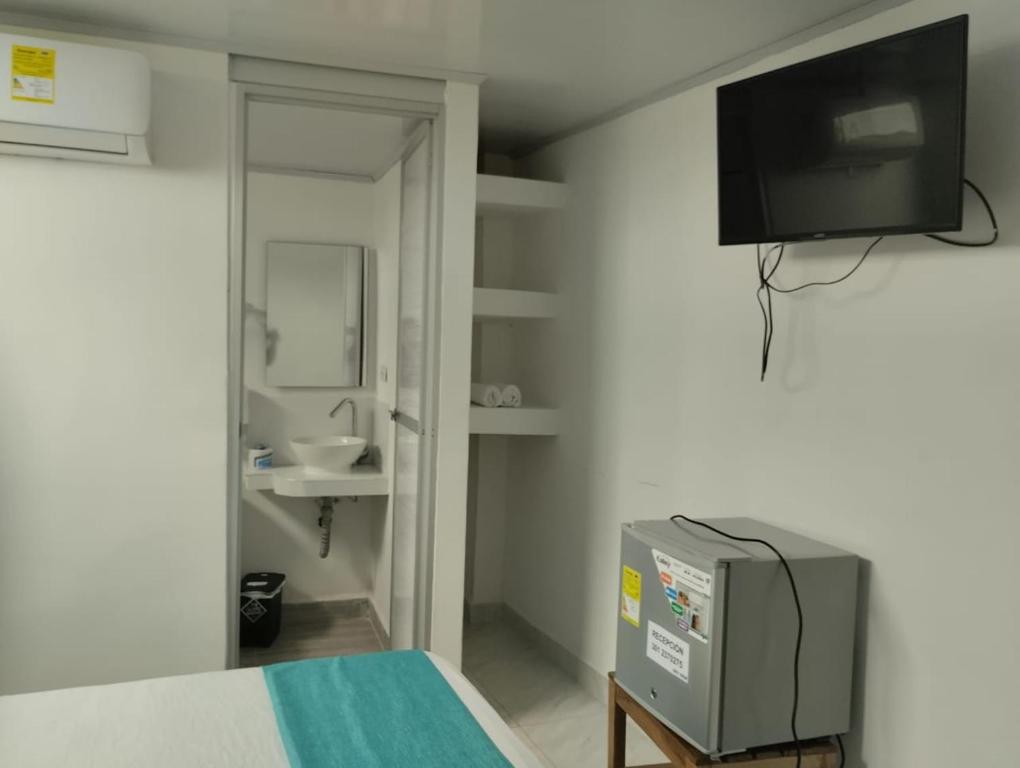 TV a/nebo společenská místnost v ubytování Sky view hotel tolu