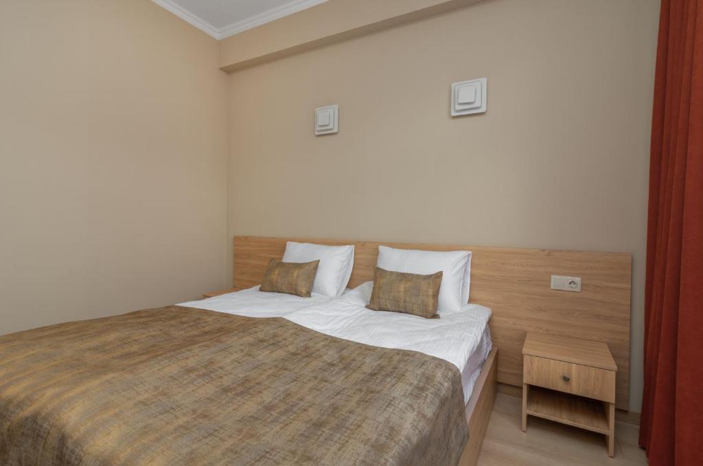Postel nebo postele na pokoji v ubytování Hotel Alexandria