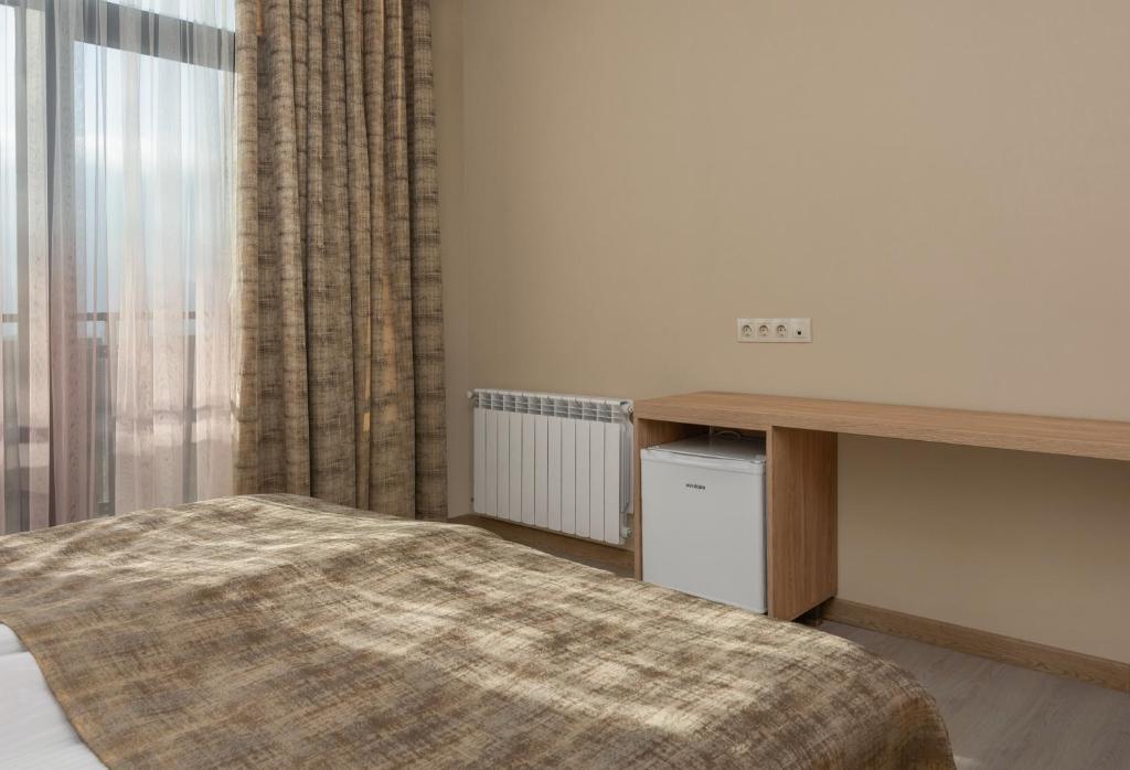 Postel nebo postele na pokoji v ubytování Hotel Alexandria