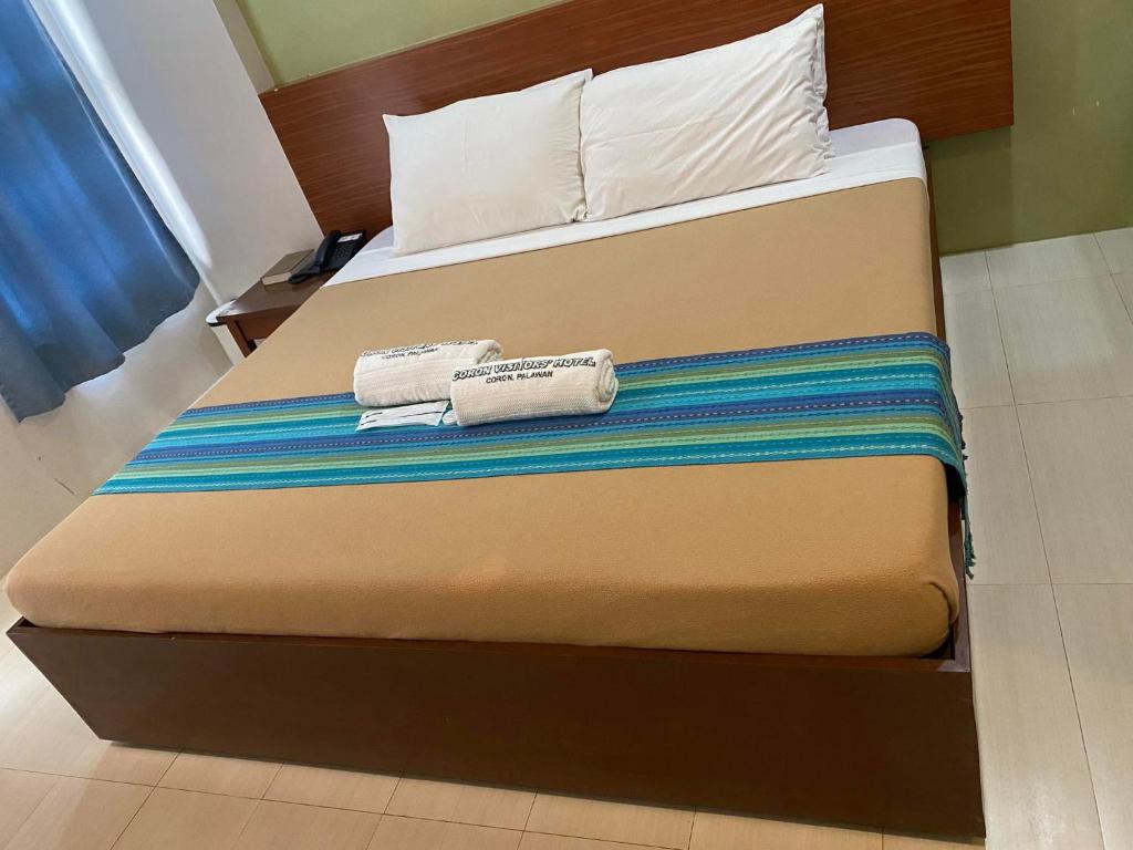 Postel nebo postele na pokoji v ubytování Coron Visitors Hotel