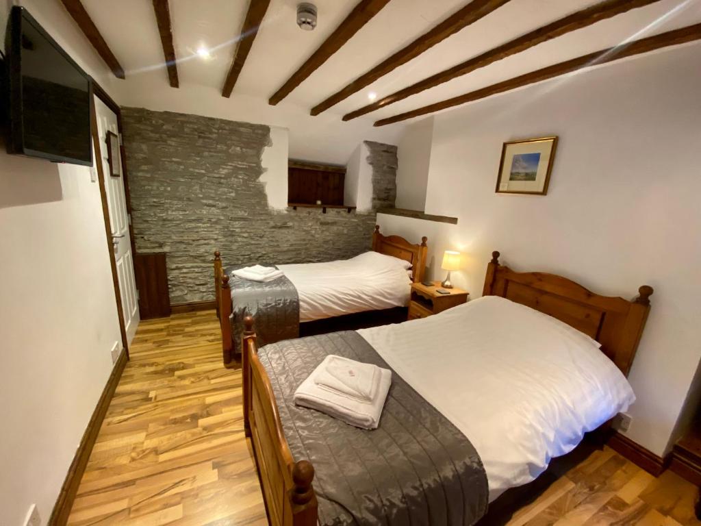 Postel nebo postele na pokoji v ubytování Seven Stars Inn
