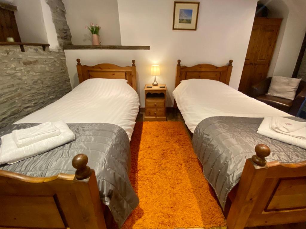 Postel nebo postele na pokoji v ubytování Seven Stars Inn