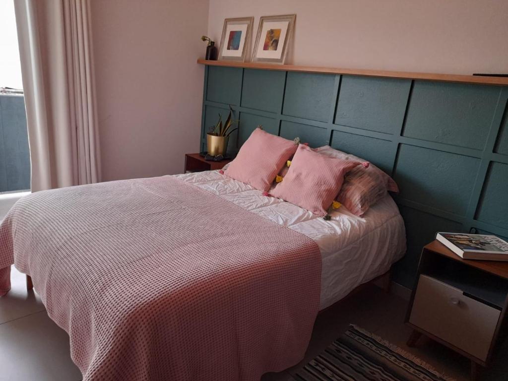 Un pat sau paturi într-o cameră la Un confortable hogar en el corazón de la CDMX.