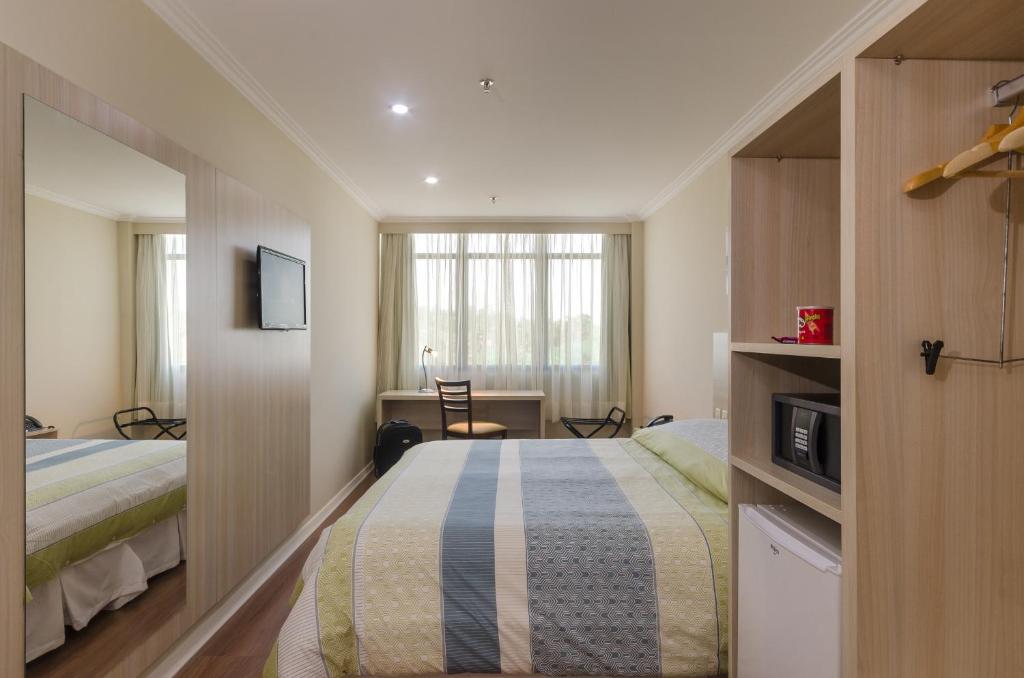 Ένα ή περισσότερα κρεβάτια σε δωμάτιο στο Seleto Hotel