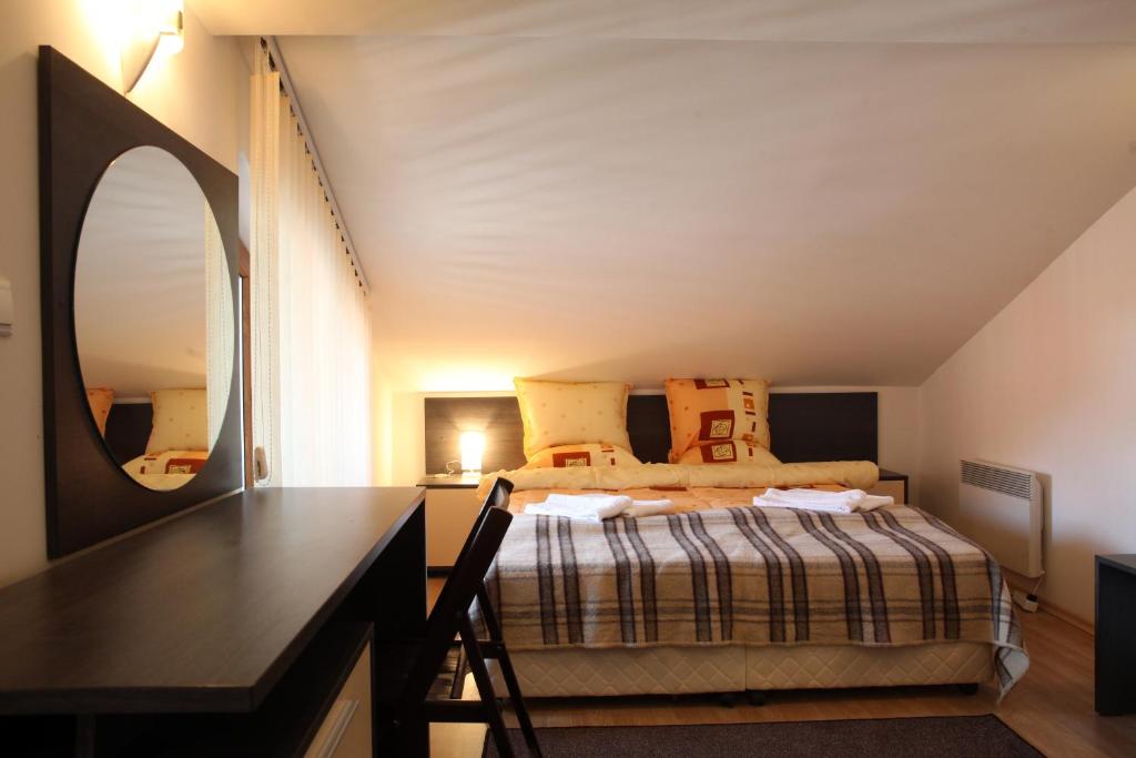 Postel nebo postele na pokoji v ubytování Guest House Koncheto