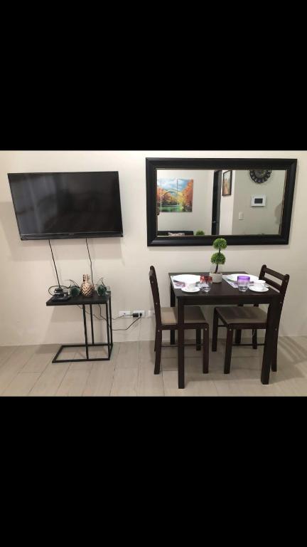 Een TV en/of entertainmentcenter bij Robles’ Unit at 81 Newport Boulevard
