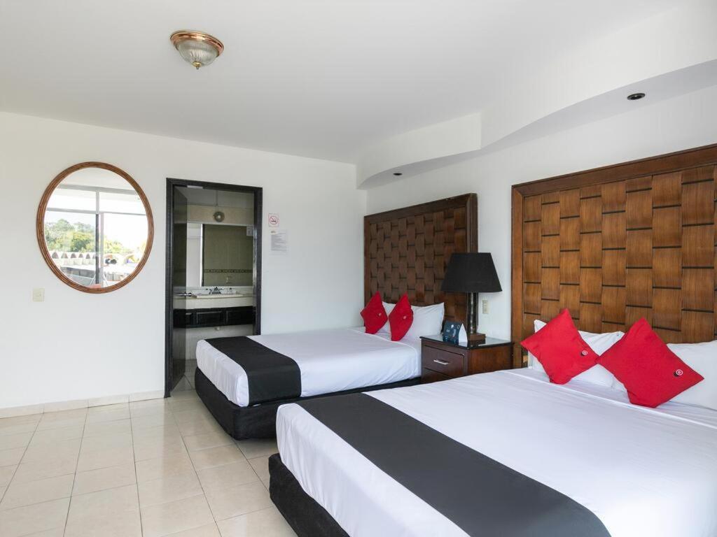 Postel nebo postele na pokoji v ubytování Zona Dorada Suites