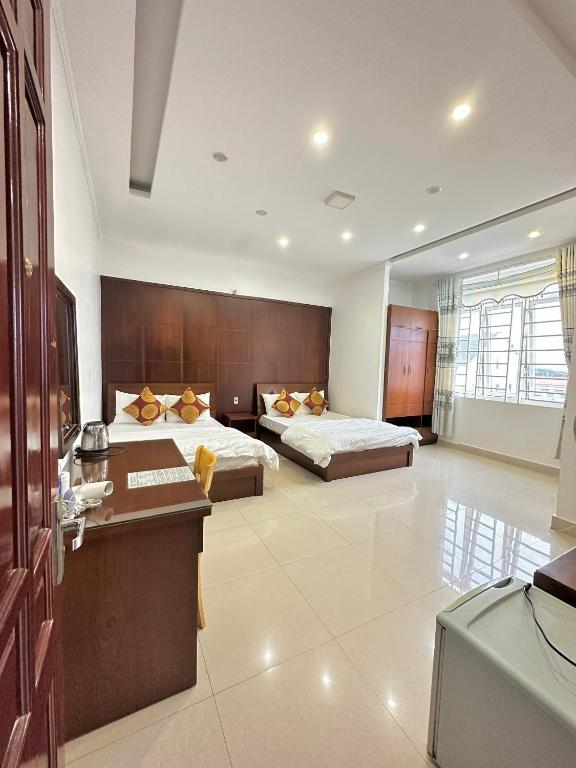 Postel nebo postele na pokoji v ubytování Hoàng Anh hotel