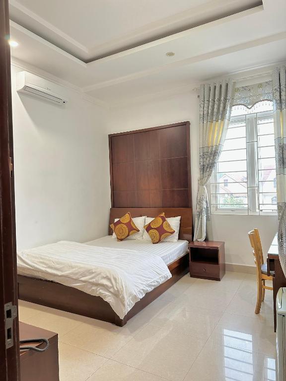 Postel nebo postele na pokoji v ubytování Hoàng Anh hotel