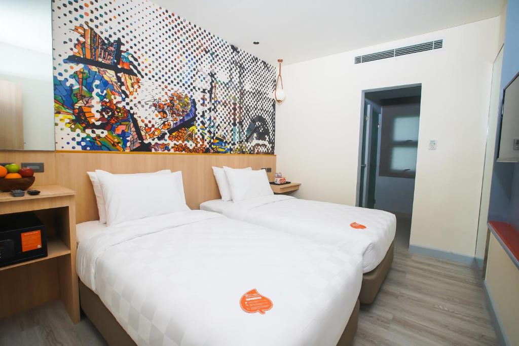 Postel nebo postele na pokoji v ubytování Go Hotels Plus Naga