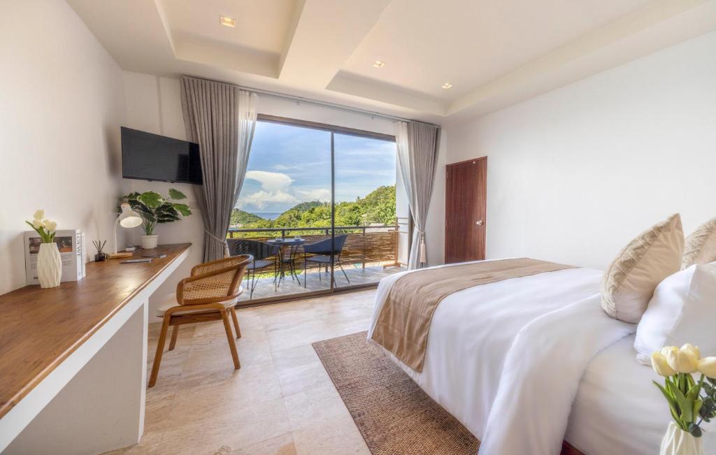 Postel nebo postele na pokoji v ubytování The AVA Resort Koh Tao