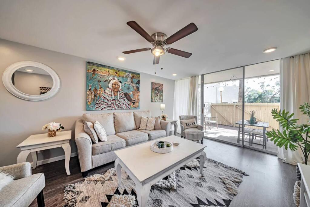 a living room with a couch and a ceiling fan at Walk to Old Town Scottsdale in Scottsdale