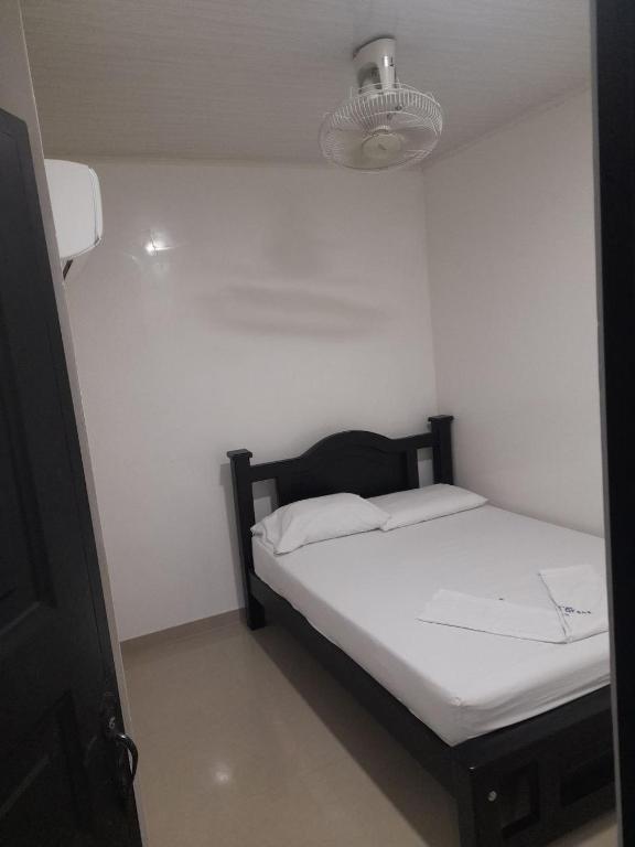 Postel nebo postele na pokoji v ubytování Hotel Villa Grant