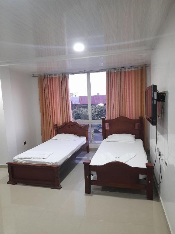 Postel nebo postele na pokoji v ubytování Hotel Villa Grant