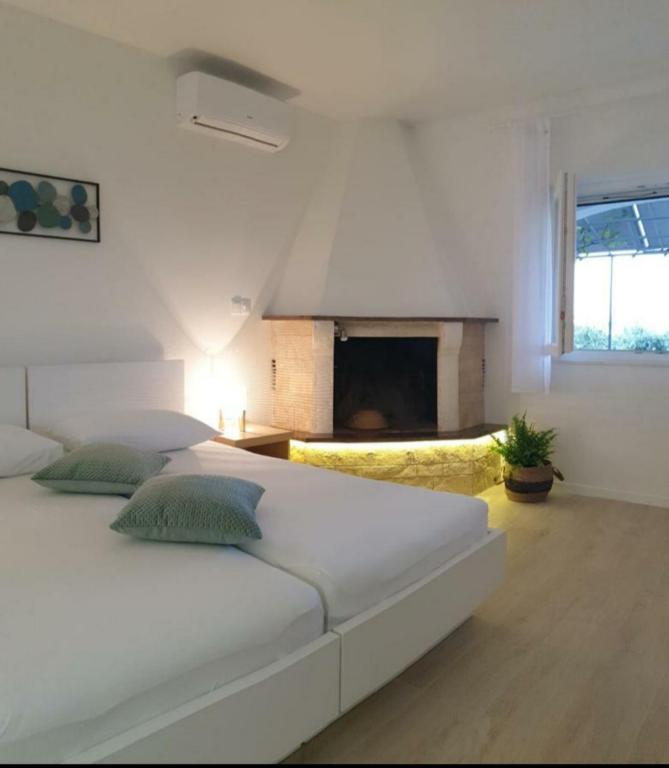 Postel nebo postele na pokoji v ubytování APARTMENTS LUMA 1