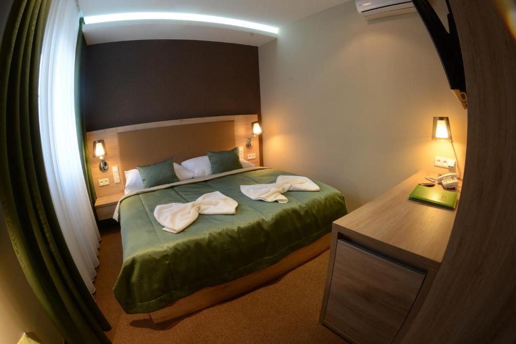 Posteľ alebo postele v izbe v ubytovaní Hotel Stardust