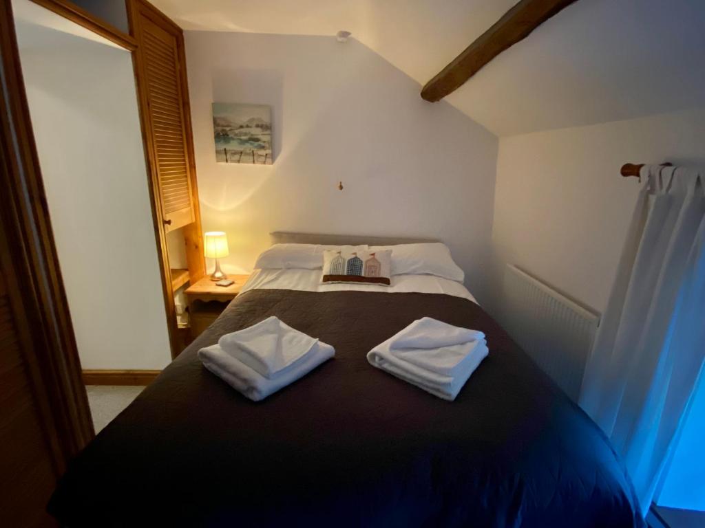 Postel nebo postele na pokoji v ubytování Seven Stars Inn