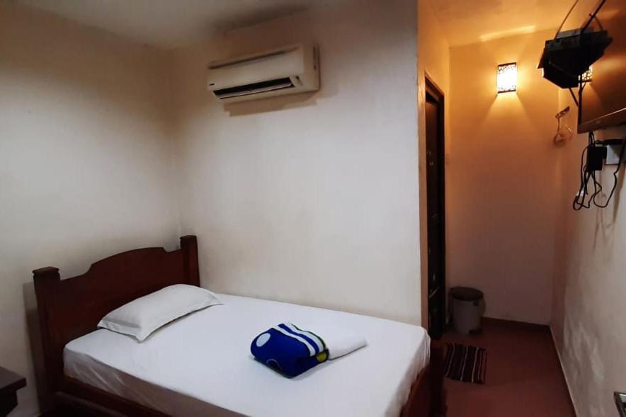 Postel nebo postele na pokoji v ubytování Hotel Aliff Tanjong Malim