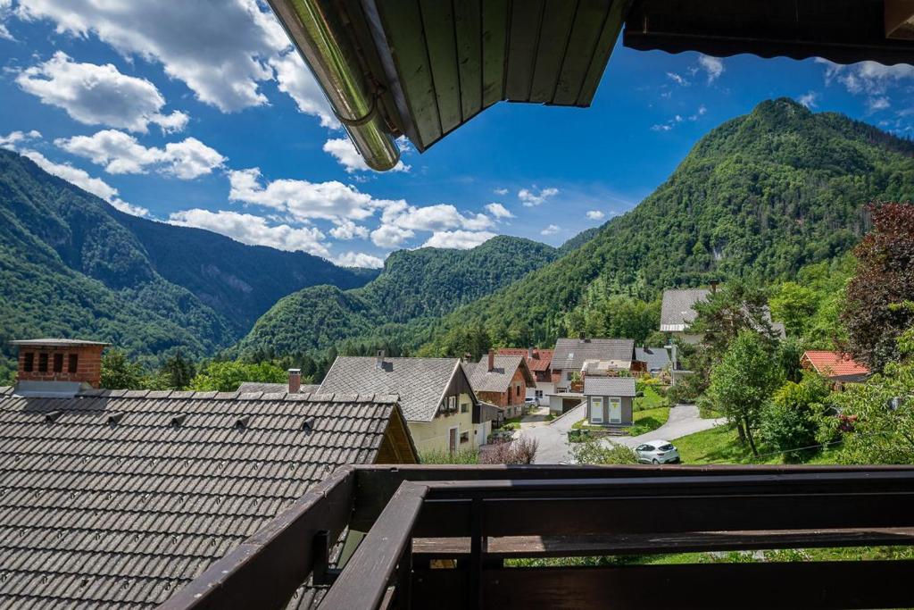 a view from the balcony of a village in the mountains at Iglica Apartments - First Floor in Bohinjska Bela