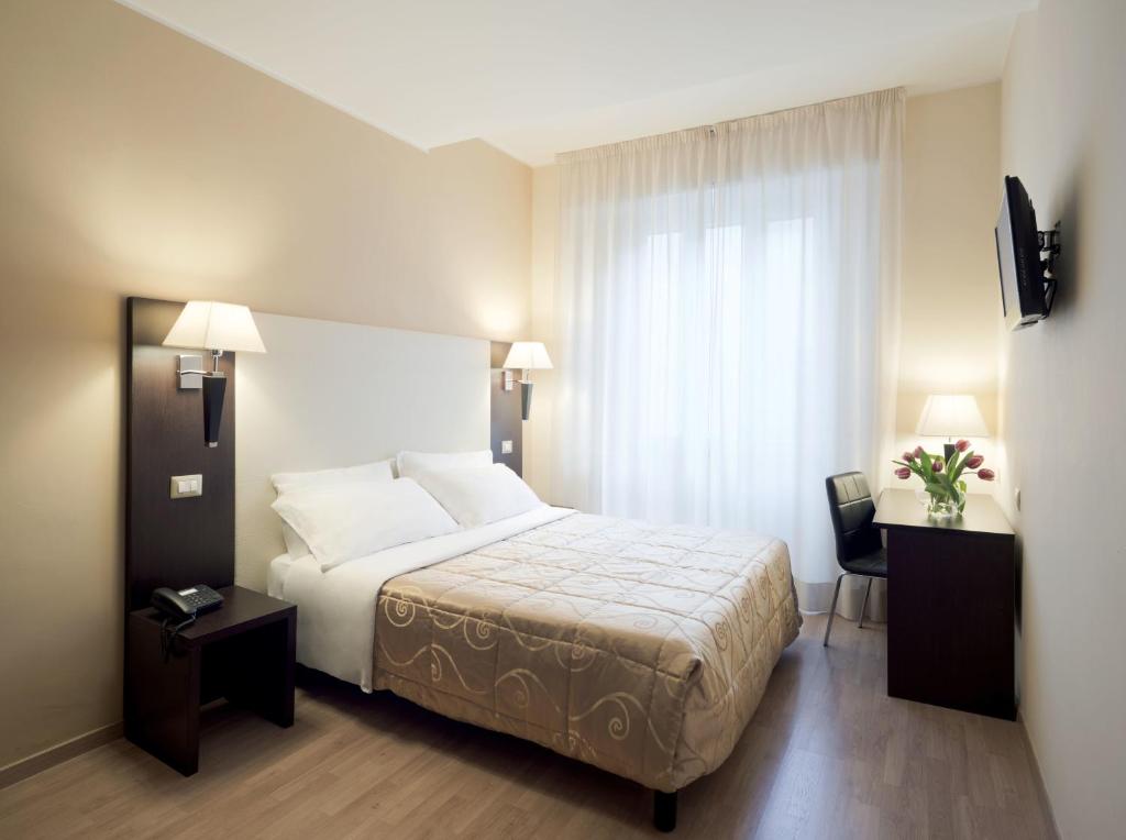 Postel nebo postele na pokoji v ubytování Hotel Aurora