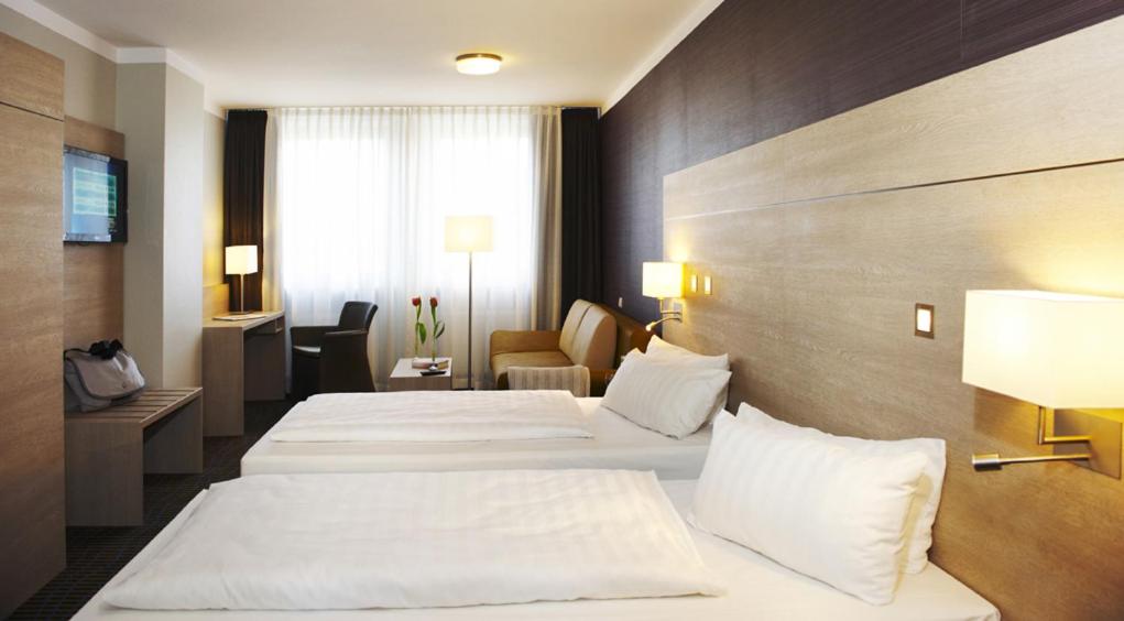 Postel nebo postele na pokoji v ubytování Stern Hotel Soller