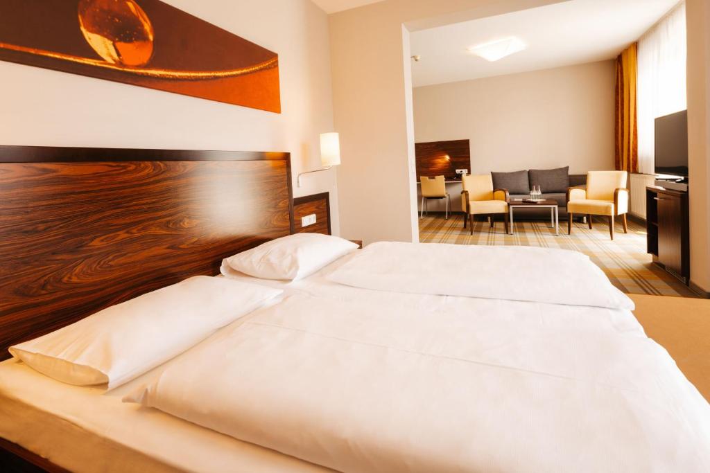 Postel nebo postele na pokoji v ubytování Hotel Liebmann