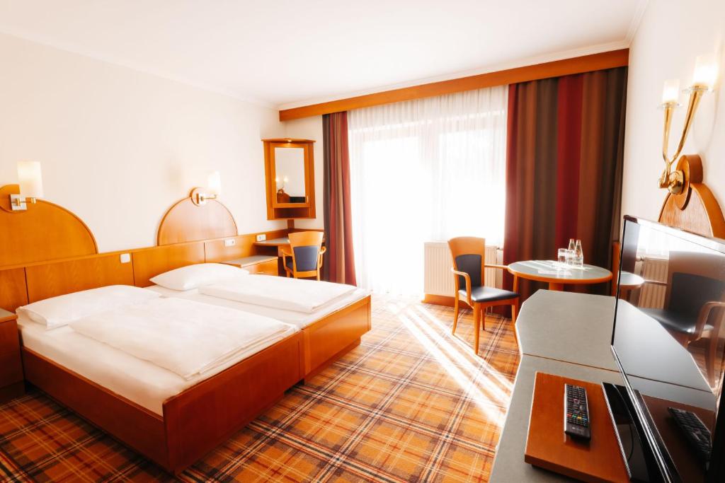 Postel nebo postele na pokoji v ubytování Hotel Liebmann