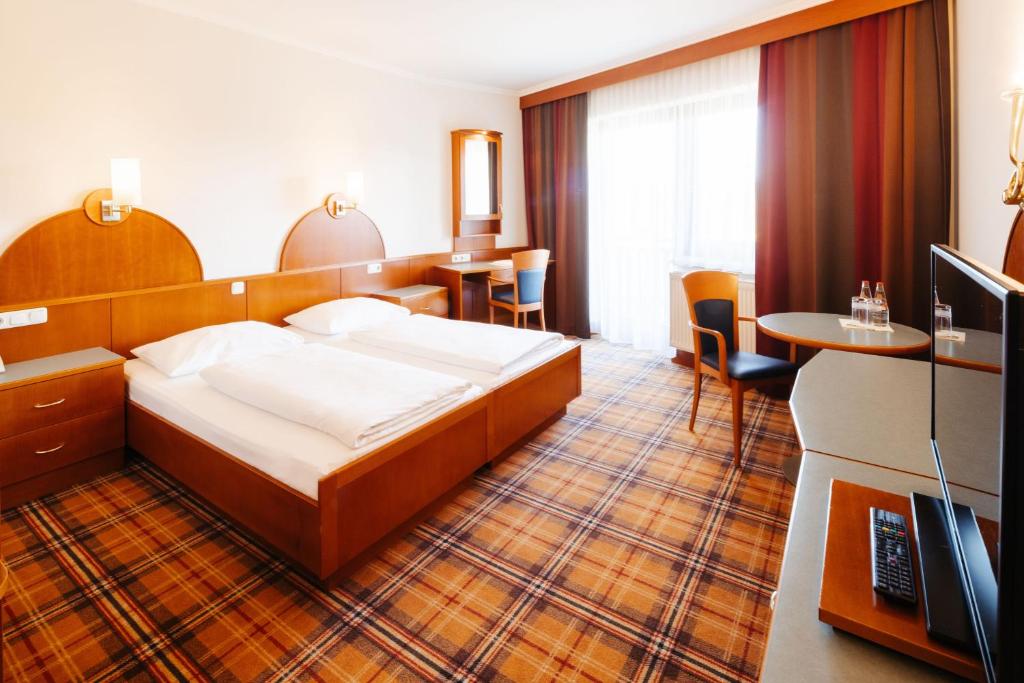 Postel nebo postele na pokoji v ubytování Hotel Liebmann