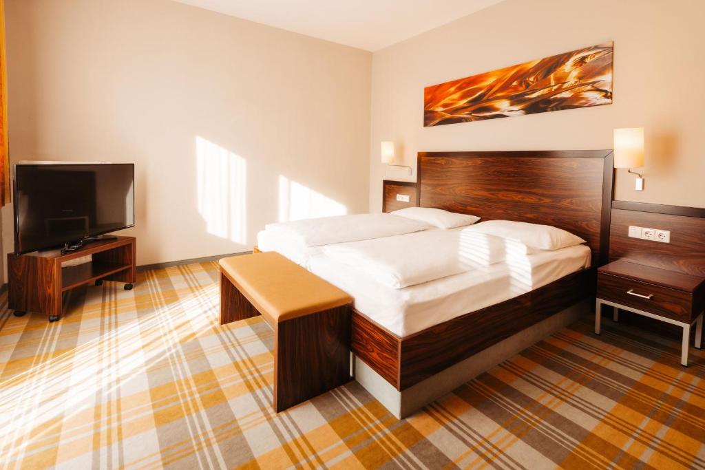 Postel nebo postele na pokoji v ubytování Hotel Liebmann