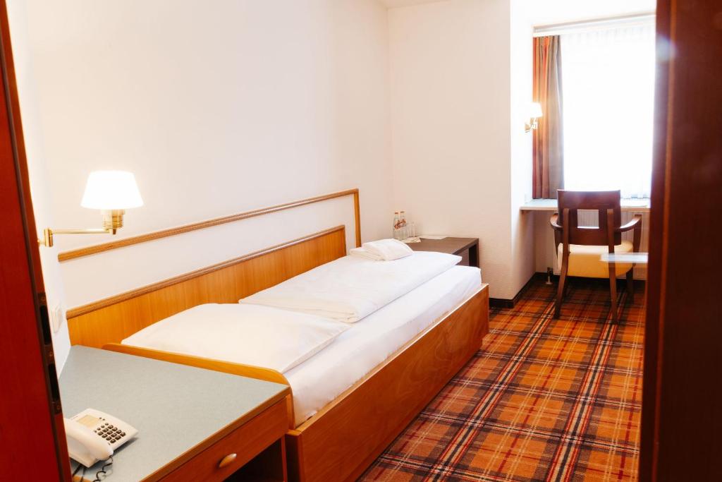 Postel nebo postele na pokoji v ubytování Hotel Liebmann