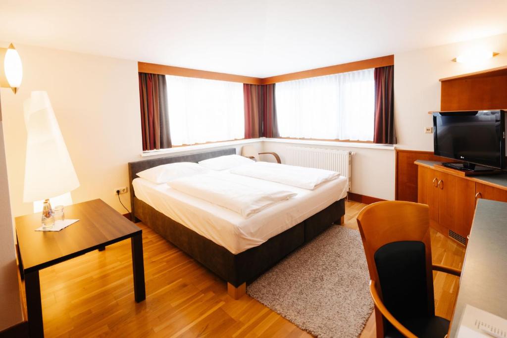 Postel nebo postele na pokoji v ubytování Hotel Liebmann