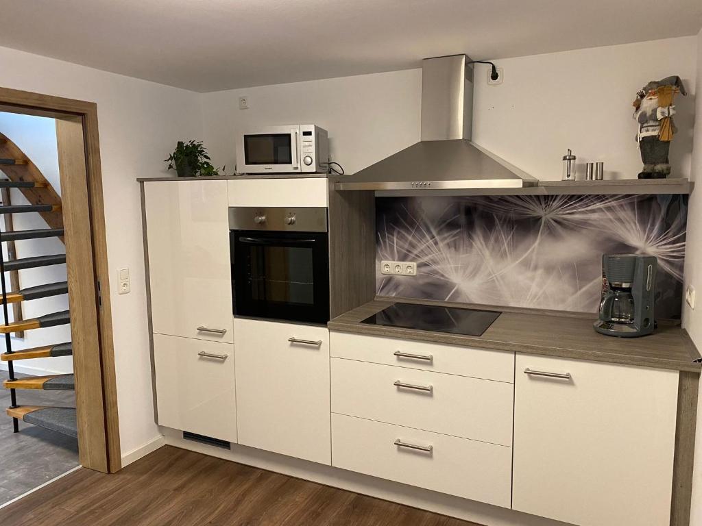 Kuchyň nebo kuchyňský kout v ubytování Ferienhaus Am Riedbach - Birstein