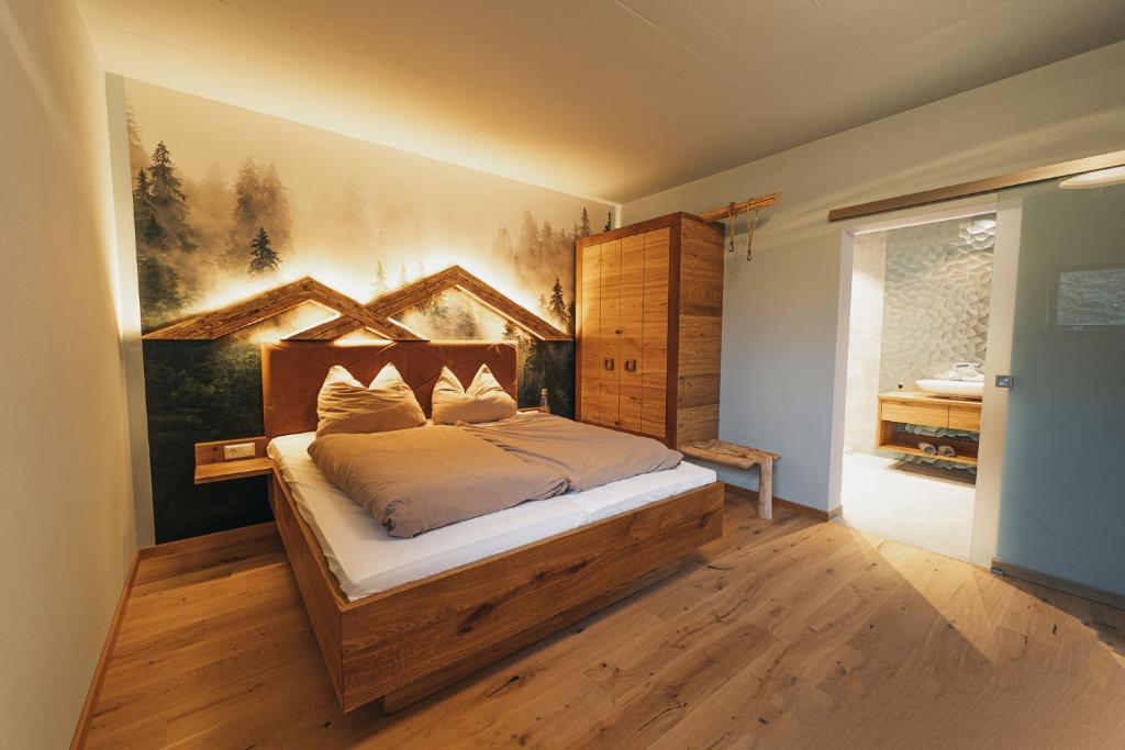 a bedroom with a bed with a wooden headboard at Bergglück in Seiffen