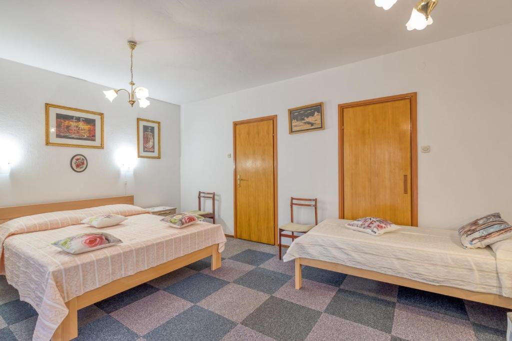 Postel nebo postele na pokoji v ubytování Apartment Complex Nevia