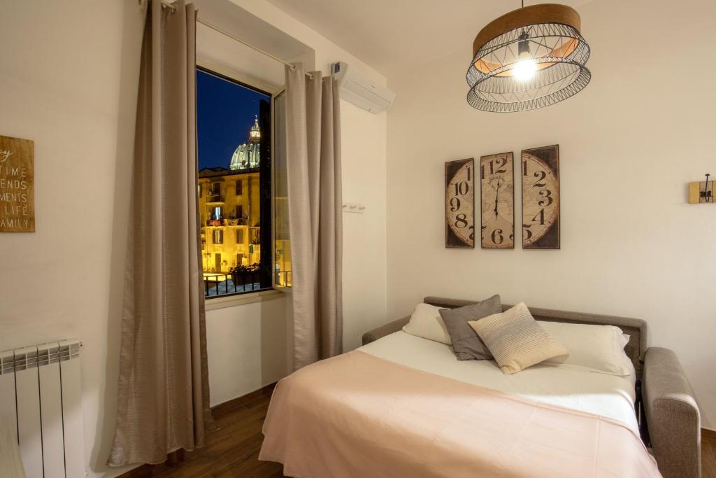 Posteľ alebo postele v izbe v ubytovaní Fornaci Vatican Flat
