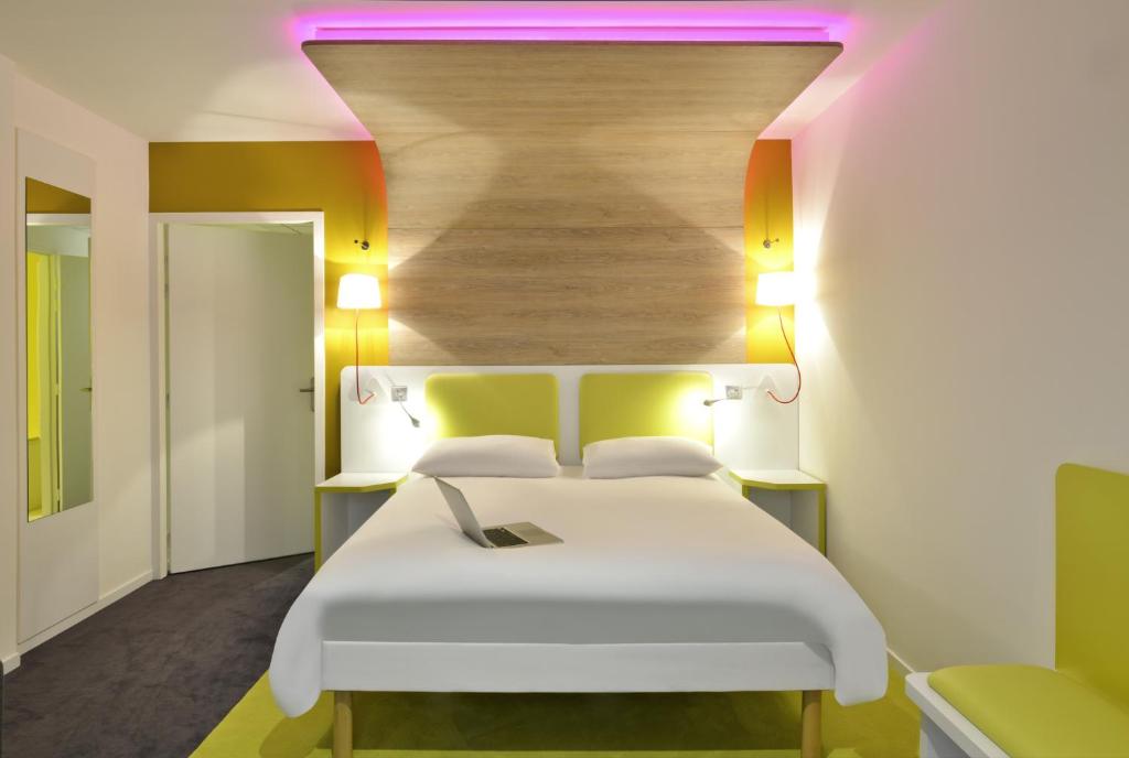 Postel nebo postele na pokoji v ubytování ibis Styles Montelimar Centre