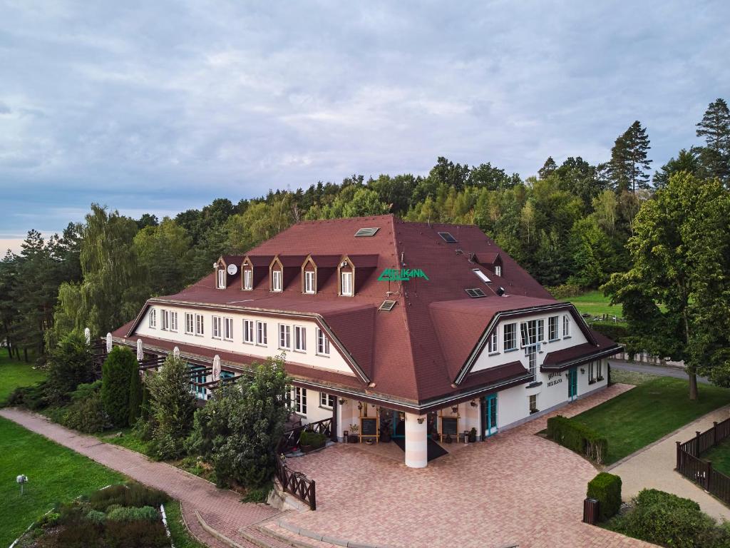 an overhead view of a large house with a roof at Motorest Melikana in Humpolec