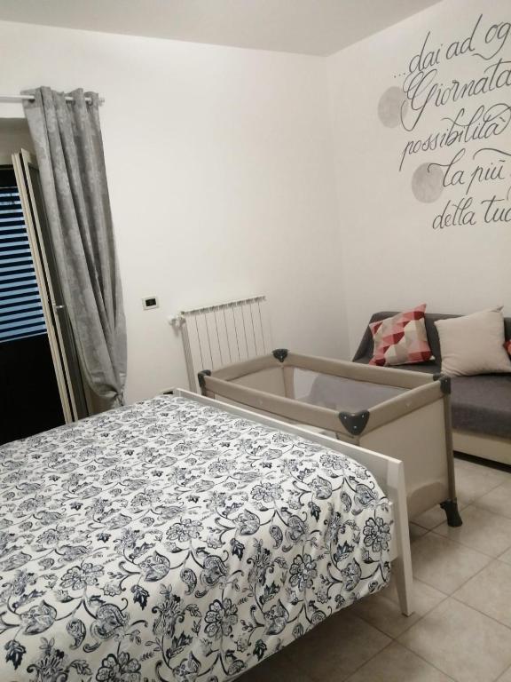 Postel nebo postele na pokoji v ubytování B&B COLLE TARIGNI