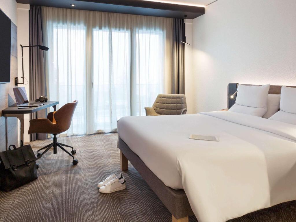 Letto o letti in una camera di Novotel Lausanne Bussigny
