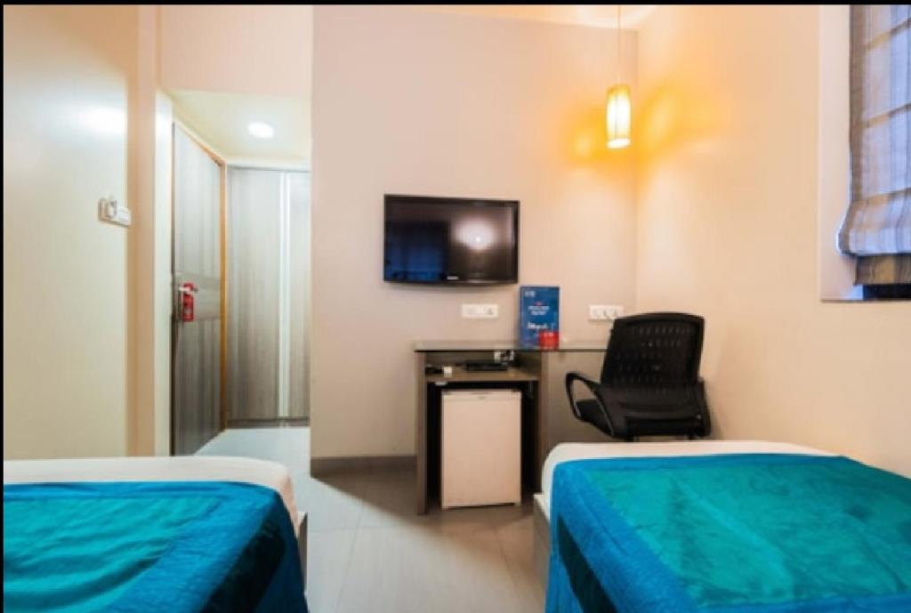 Uma cama ou camas num quarto em Apollo Guest House