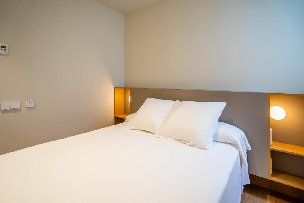 Postel nebo postele na pokoji v ubytování Teide Rooms