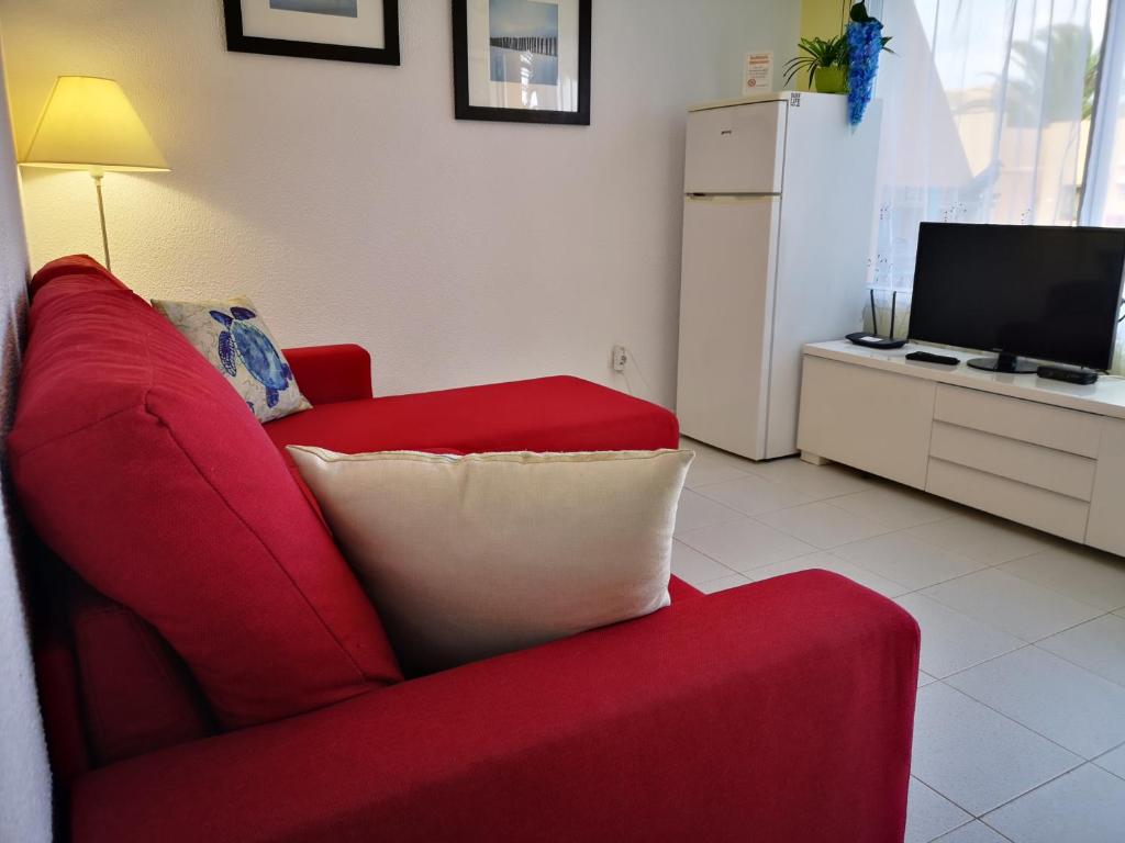 Televízia a/alebo spoločenská miestnosť v ubytovaní MerieElisabethSunApartment
