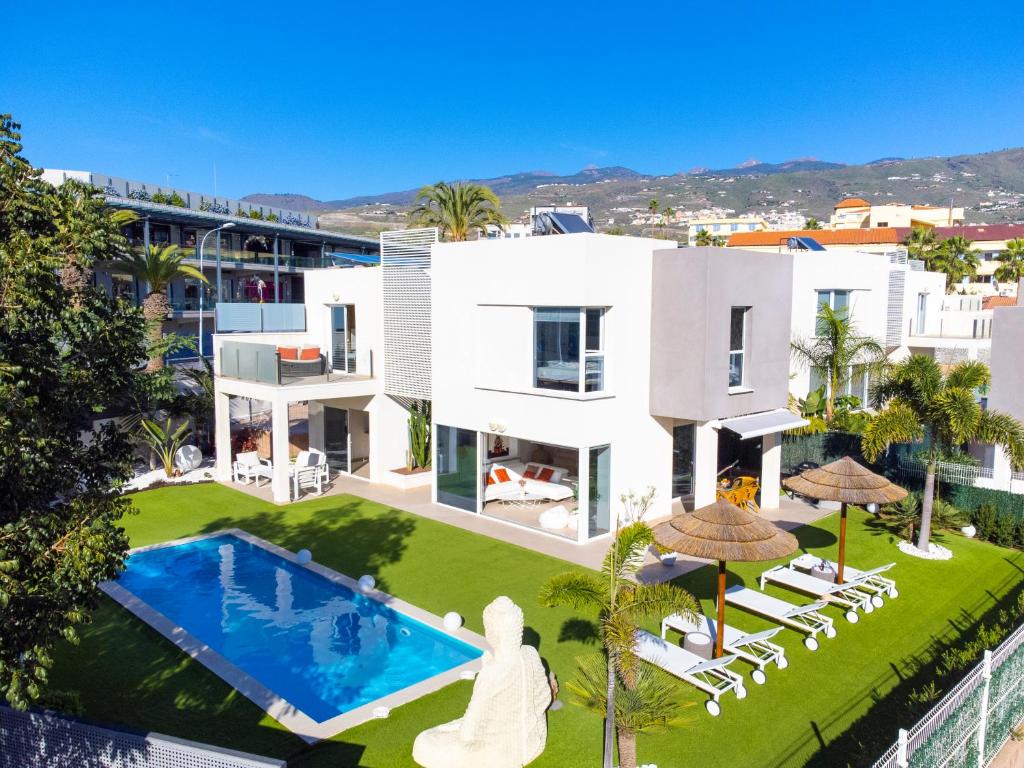 an aerial view of a house with a swimming pool at 149 VILLA OASIS Buddha Garden by Sunkeyrents in Adeje