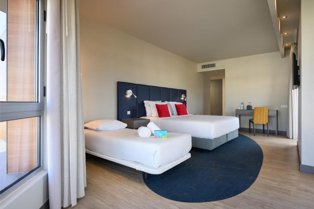 Кровать или кровати в номере Melia Setubal