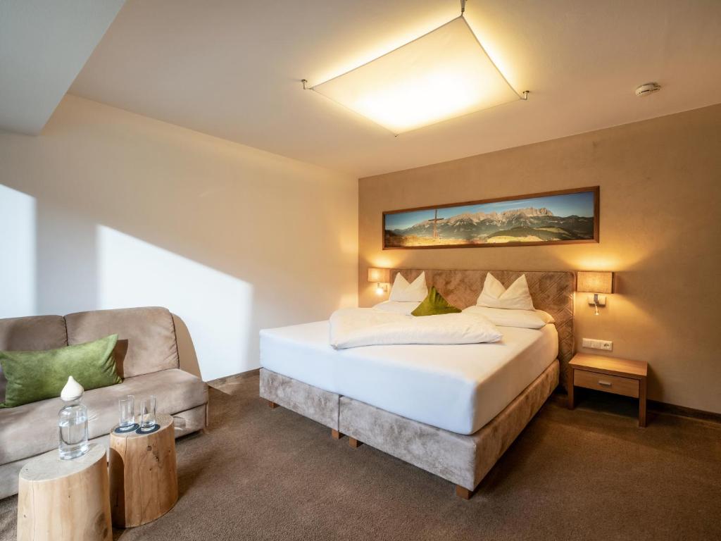 Een bed of bedden in een kamer bij Gasthof Ellmauer Hof